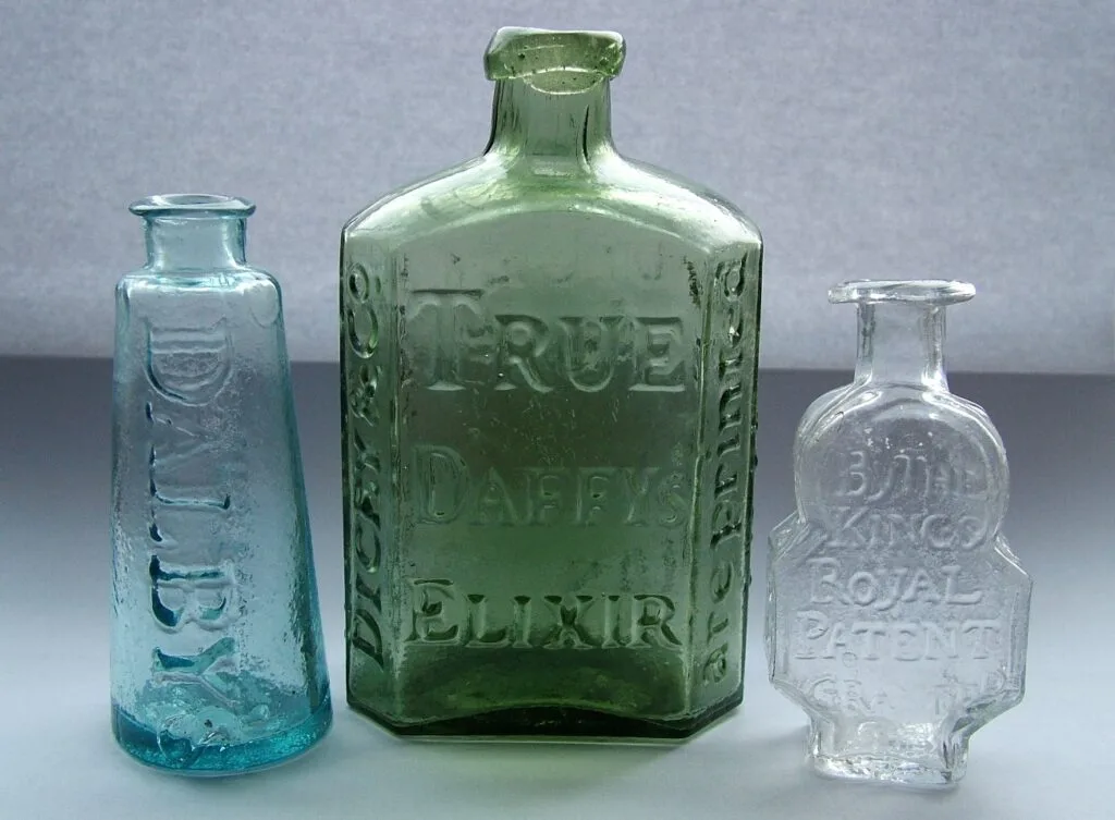 Three old antique medicine bottles