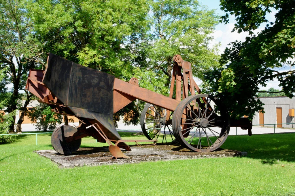 A large Tractor Pulled Plow in a farm