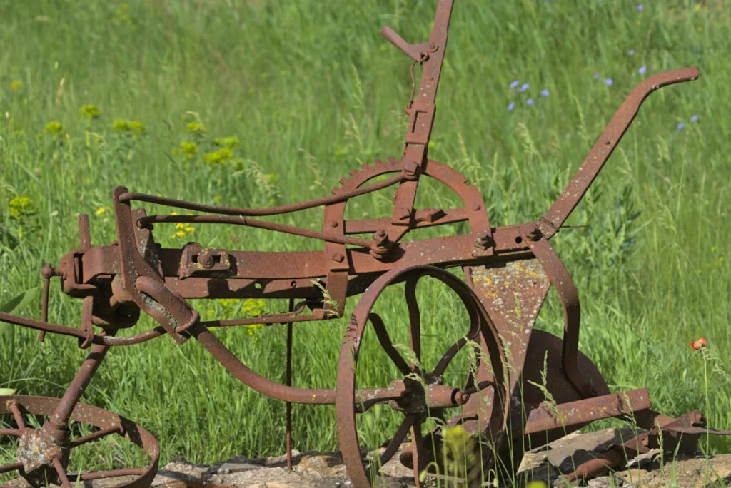 Antique Walking Plow in a Field