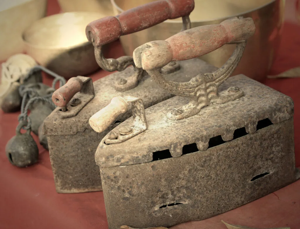 Vintage Handmade Sad Irons with Carved Handles and Rivets