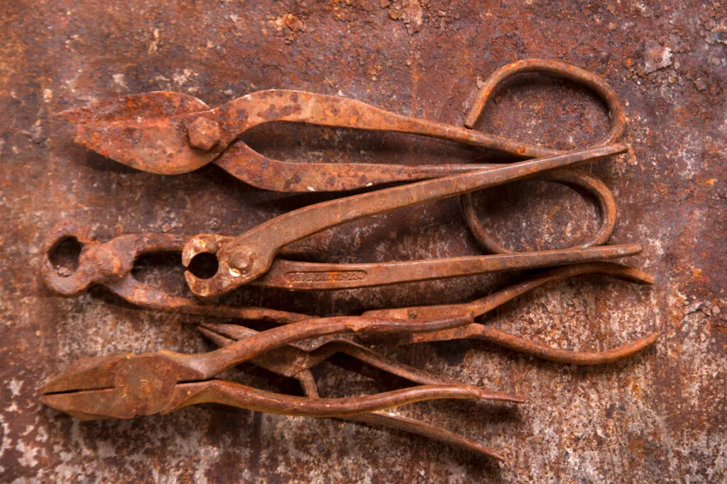 Old and Rusty Pliers on Table