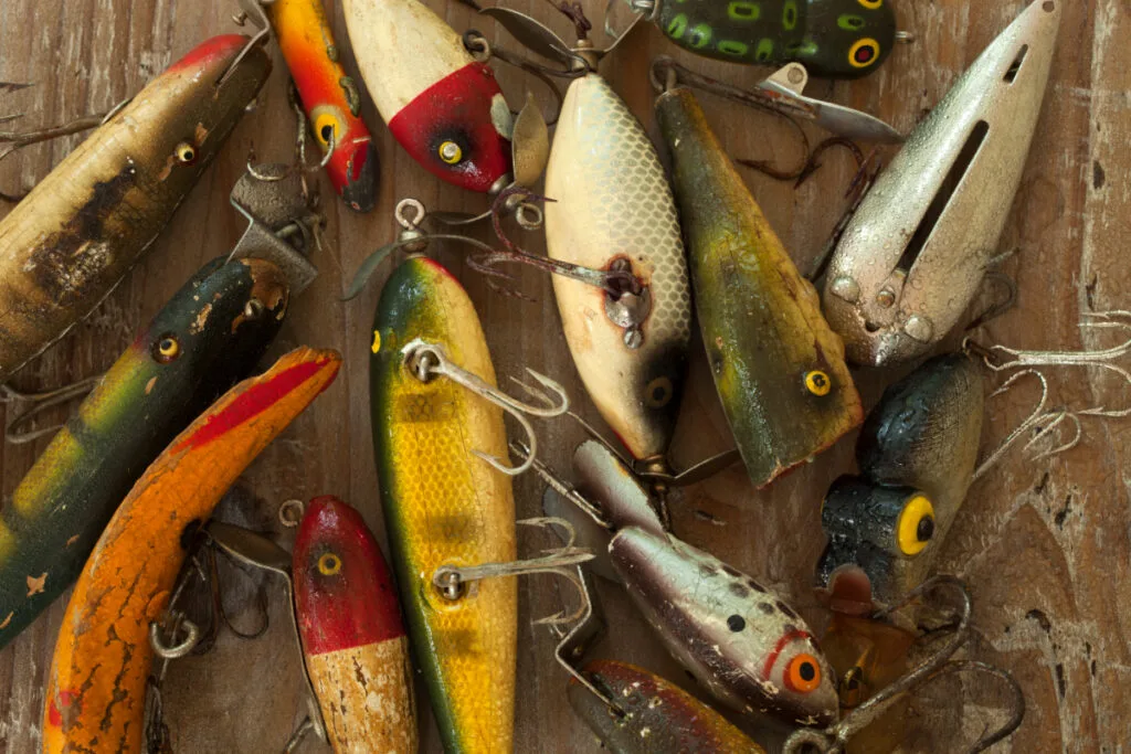 Different types of handpainted fishing lures in the antique market
