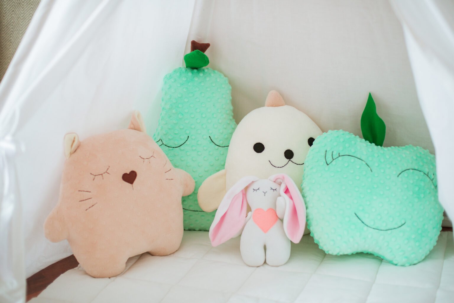 Rarest Multicolored Squishmallows on a Bed