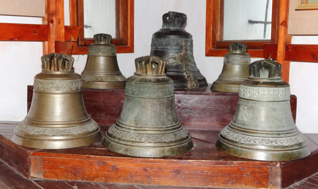 A Group of Antique Cast Iron Bells of Different Sizes