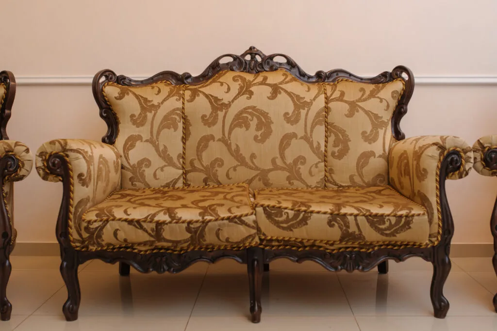 Antique Sofa with Beige Cushions