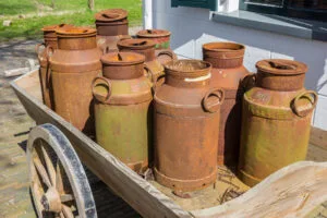 Old & Rusty Milk Cans on a Cart