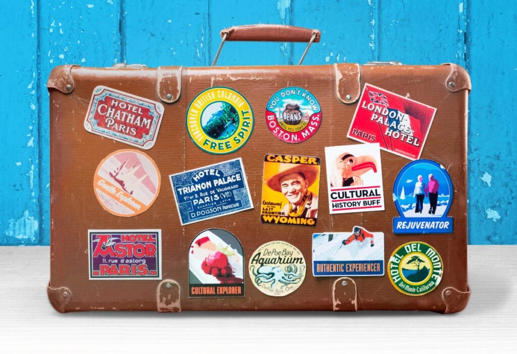 Vintage Suitcase With Travel Stickers